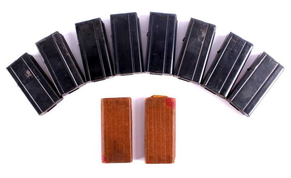 M-1 Carbine Magazines This lot includes 10 M-1 Car: This lot includes 10 M-1 Carbine magazines. 2 are still wrapped in paper. The remainder are in very good condition. They each measure 1.875" x 3.875".
