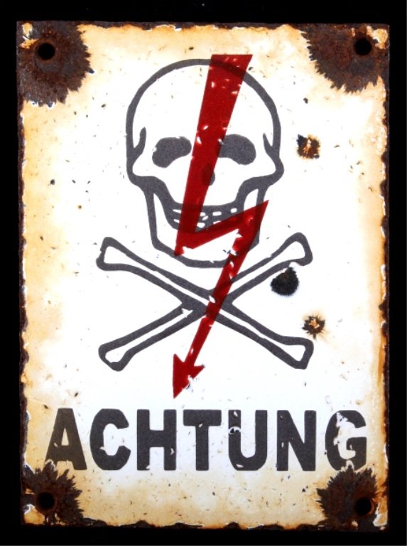 German Porcelain Sign his sign features a Skull an: his sign features a Skull and Crossed Bones with a red lighting rod down the center saying, "Achtung!." This translate from German to English to mean, "Attention." There is some loss to the Porcelain