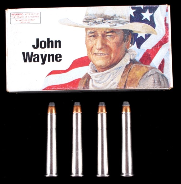 Winchester "John Wayne" Commemorative 32-40 Ammo T: This lot features a box of 32-40 ammo from Winchester. This box is a John Wayne commemorative edition. The box is full, containing 20 unfired cartridges. The box is in very good condition showing brig