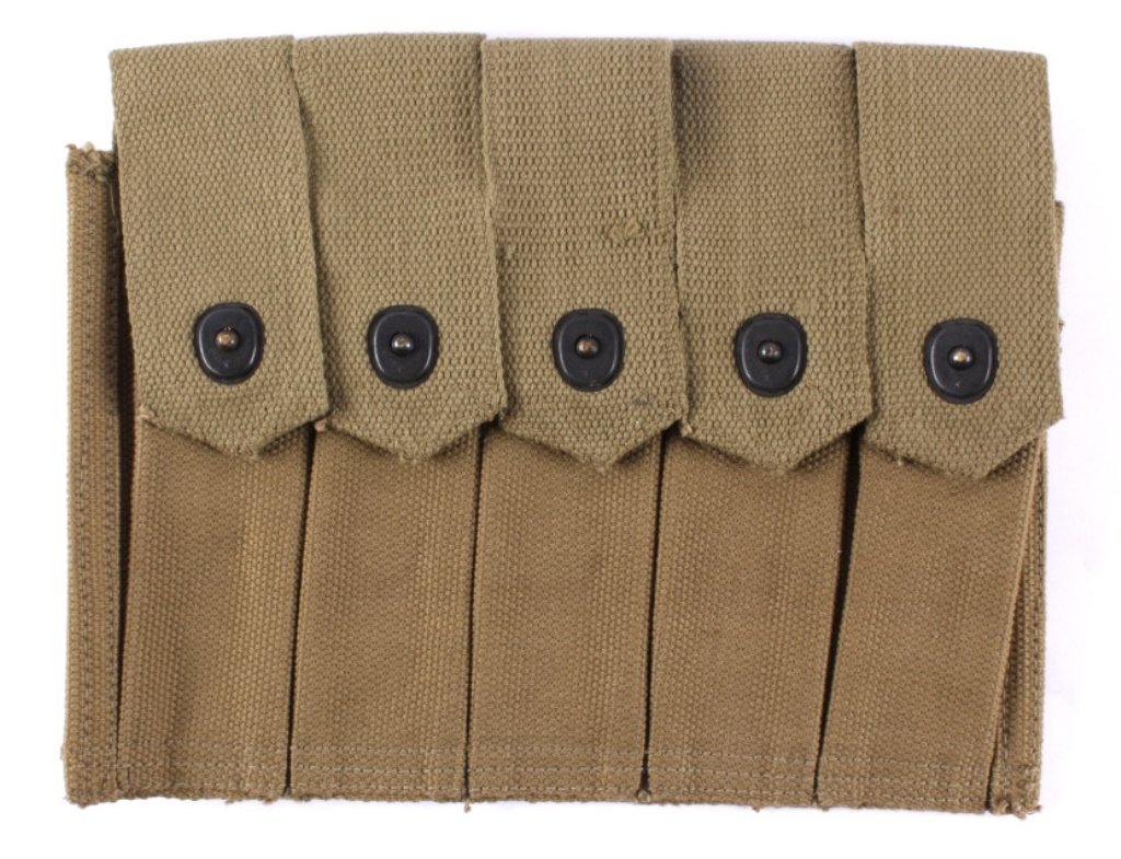 Unissued Thompson Submachine Gun Ammo Belt This lo: This lot features a Thompson submachine gun ammo belt. It was never issued, therefore, it is not battle used. The back of the belt is marked "U.S.". The belt is in excellent condition and measures 8.5