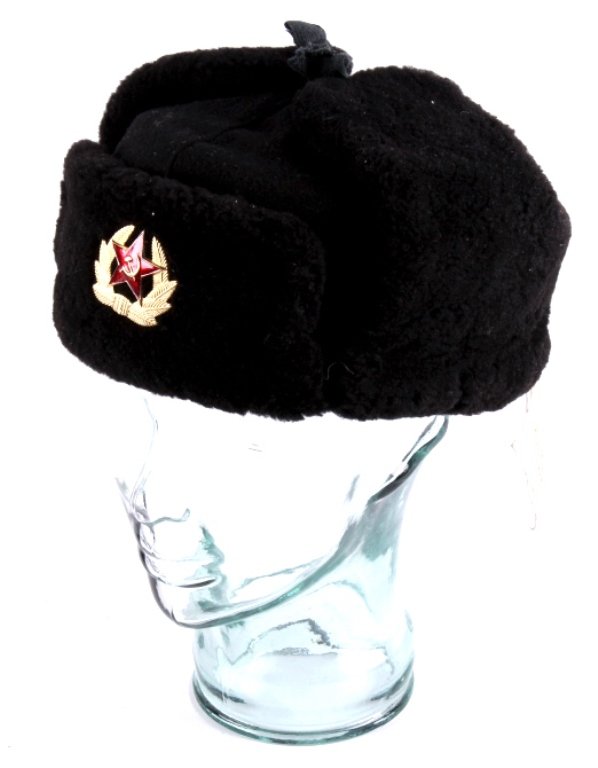 Russian Ushanka Military Hat This lot features a R: This lot features a Russian military hat. This hat is called a Ushanka, a type of hat with ear flaps that can be tied at the top of pulled down over the ears in cold weather. The hat is in very good c