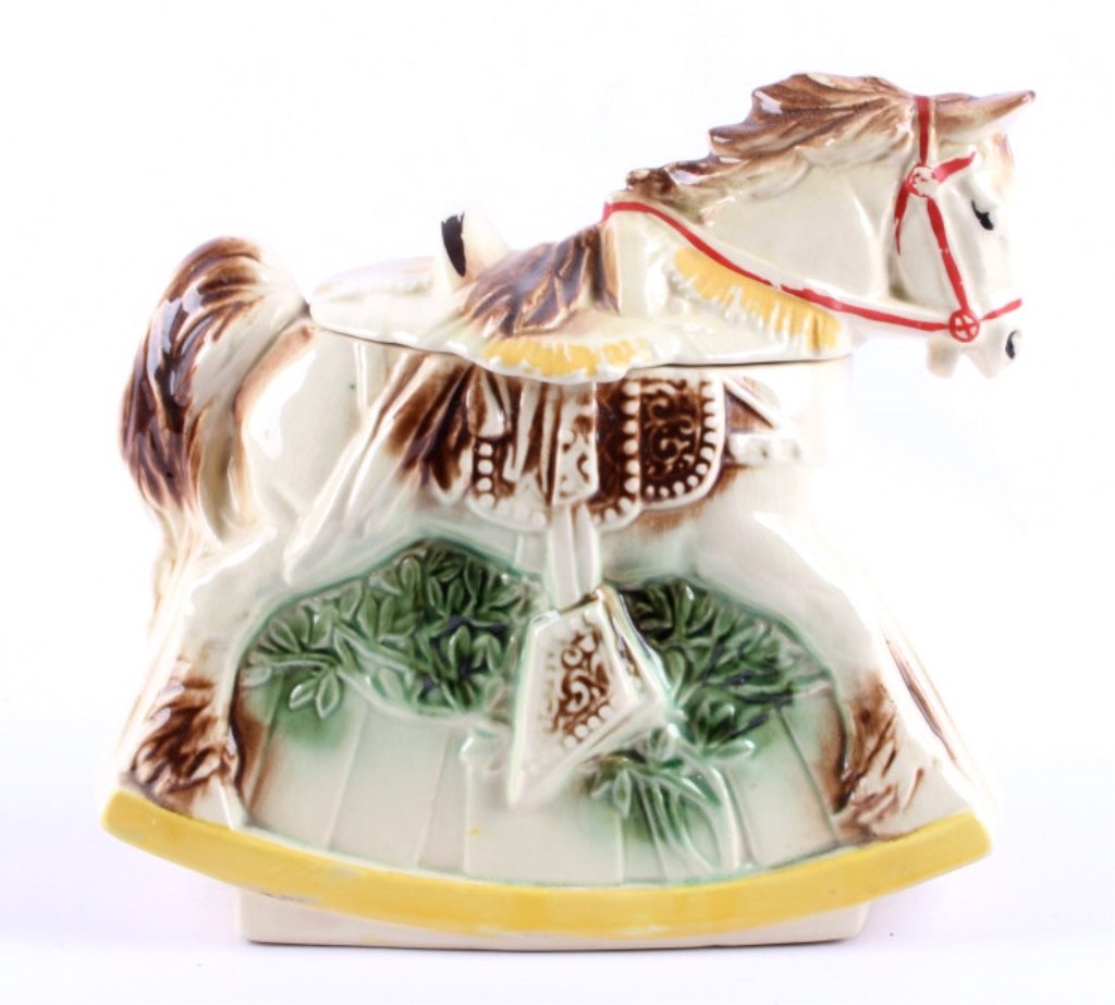 Rocking Horse Porcelain Cookie Jar McCoy This piec: This piece is in mint condition marked on the bottom McCoy USA. This is an old piece shows great hand painted accents. Measures 9.5" tall and 11"x5"