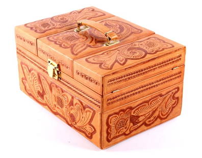 Tooled Leather Travel Grooming Case The case shows: The case shows hard walls covered in hand tooled leather both outside and inside. The piece is in great condition and is very well made showing beautiful craftsmanship. When opened it shows