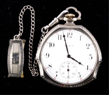 Elgin Pocket Watch 14kt Gold Filled circa 1911 Thi: This piece is an Elgin pocket watch made in 1911 and is made of 14kt White Gold filled. This watch was made in Elgin, USA by the Elgin watch Company. This watch is in good condition, recently