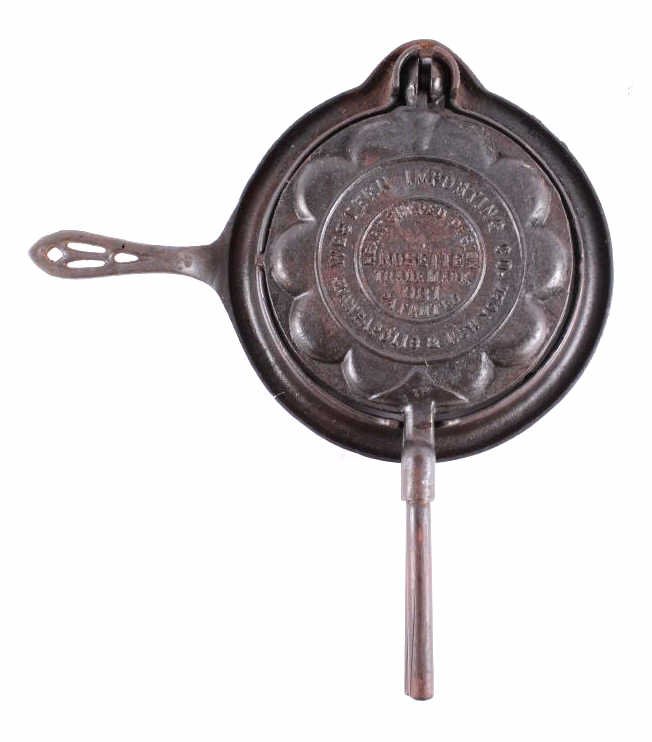 Western Importing Co Waffle Iron No. 8 This is a W: This is a Western Importing Co. waffle iron made by Griswold. The waffle iron has a unique and desirable heart shaped design. The waffle iron is marked on the top, "Western Importing Co. Minneapolis &