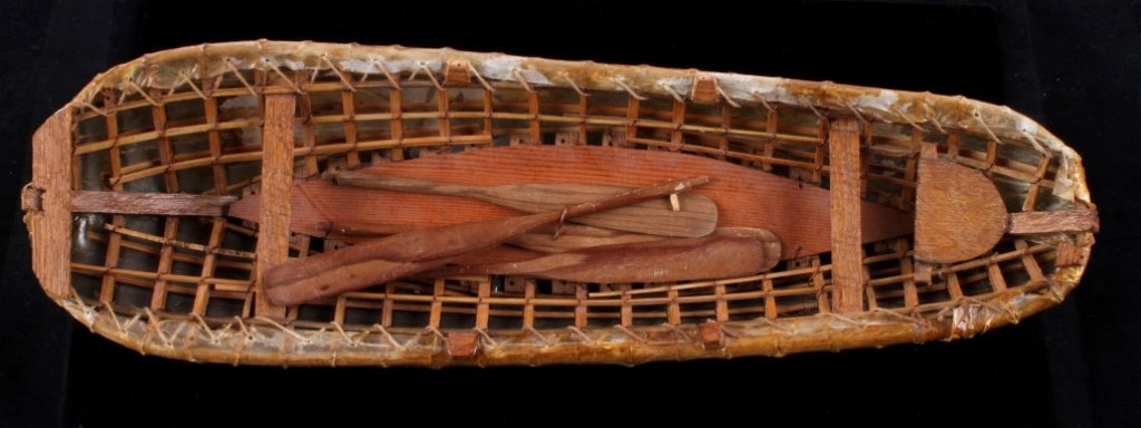 Eskimo Inuit Umiak Seal Skin Boat circa 1930-40 Th: This is an original Eskimo or Inuit Native American Indian Umiak boat. The boat shows a seal skin bottom and shows all the oars and frame made of red cedar. The piece is in good condition and measures