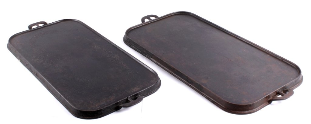 Wagner Cast Iron Griddles This lot includes a pair: This lot includes a pair of Wagner cast iron long griddles. The first one is marked "WAGNER WARE SIDNEY, O 1150". It measures 11.75" x 23.5". The second one is marked "WAGNER WARE". It measures 12.75"