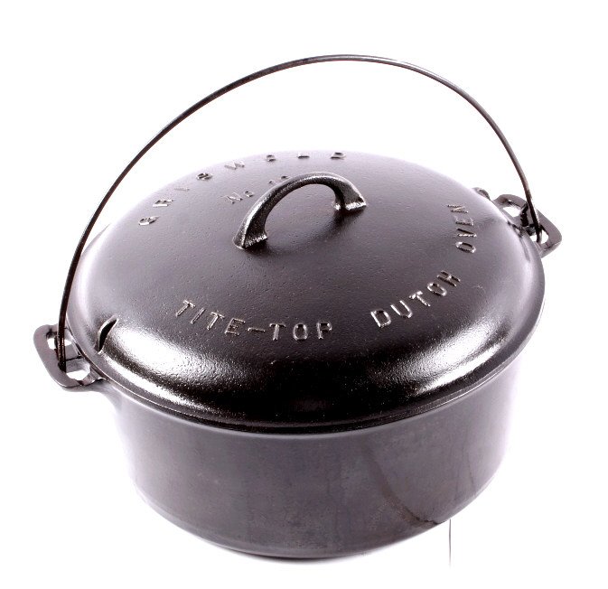 Griswold Cast Iron "10" Dutch Oven This lot featur: This lot features a Griswold cast iron Dutch oven circa 1920. The cover is marked " GRISWOLD No 10 TITE-TOP DUTCH OVEN PATENTED FEB. 10, 1920 GRISWOLD (logo) ERIE PA., U.S.A. 2553 A". The Dutch oven i