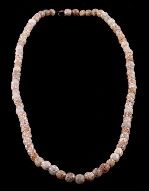Blackfoot Fancy Clear Skunk or Crows Eye Beads The: The lot shows a strand with 85 original Venetian Italian clear skunk or crows eye beads. These beads were made during the early to mid 1800's. These beads were traded to the Blackfoot Native American