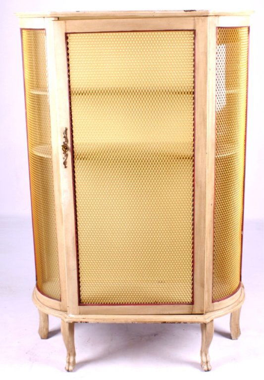 Antique Painted Curved Glass Curio Cabinet This lo: This lot features an antique painted curved glass curio cabinet. The cabinet has a wire screen similar to a pie safe. Each side of the cabinet and the door has a piece of glass behind the screen. The
