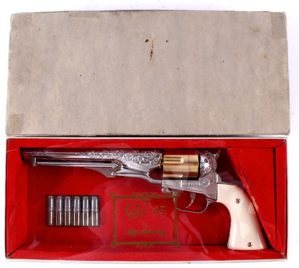 Hubley Colt .45 Cap Gun This lot features a Hubley: This lot features a Hubley Colt .45 cap gun. This cap gun is in mint condition in the original box. Included with the cap gun are 6 life-like bullets. The bullets fit into the gun to add a realistic e