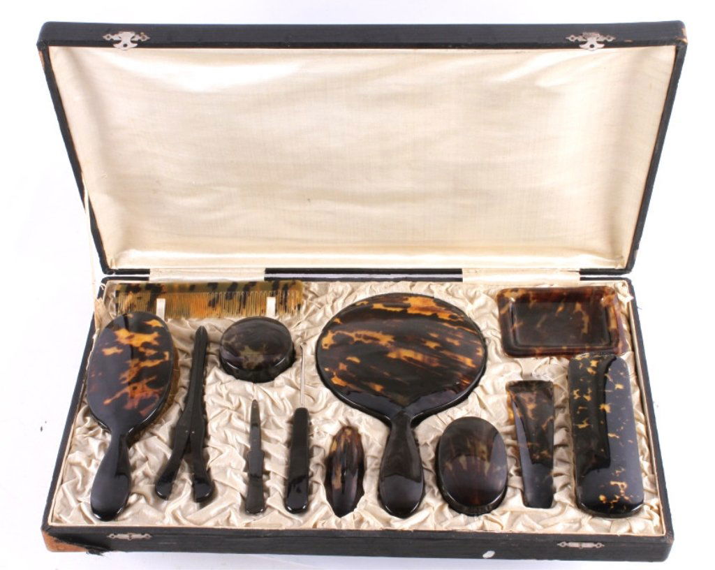 Antique Chinese Tortoise Shell Vanity Set The lot: The lot features a complete all original very rare set of 13 vanity pieces all made of Tortoise Shell. The pieces were hand made in China and are genuine antique. The se comes in a custom box that is