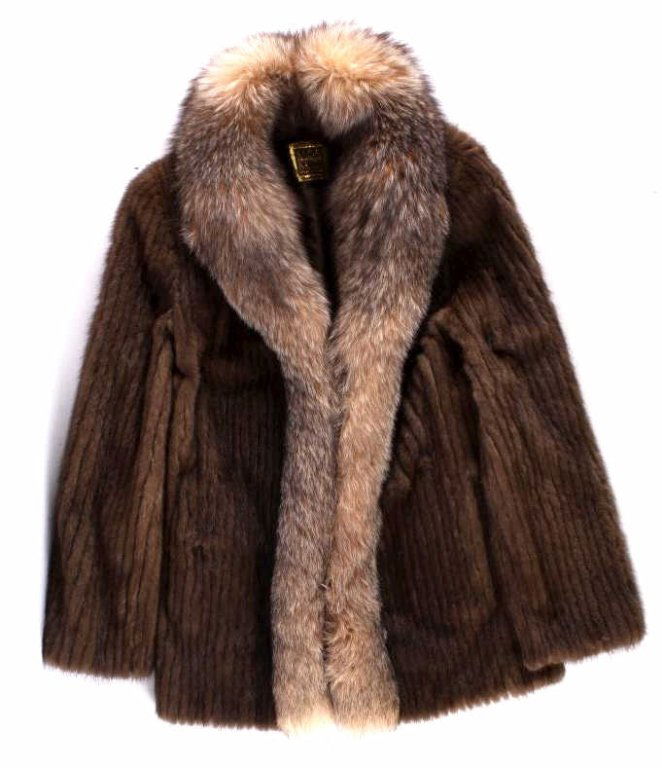 Saga Mink Fur Coat The coat shows near mint condit: The coat shows near mint condition and shows all authentic Mink fur with beautiful Fox collar. The coat shows wonderful coloring. The coat is by Saga and is a size small.