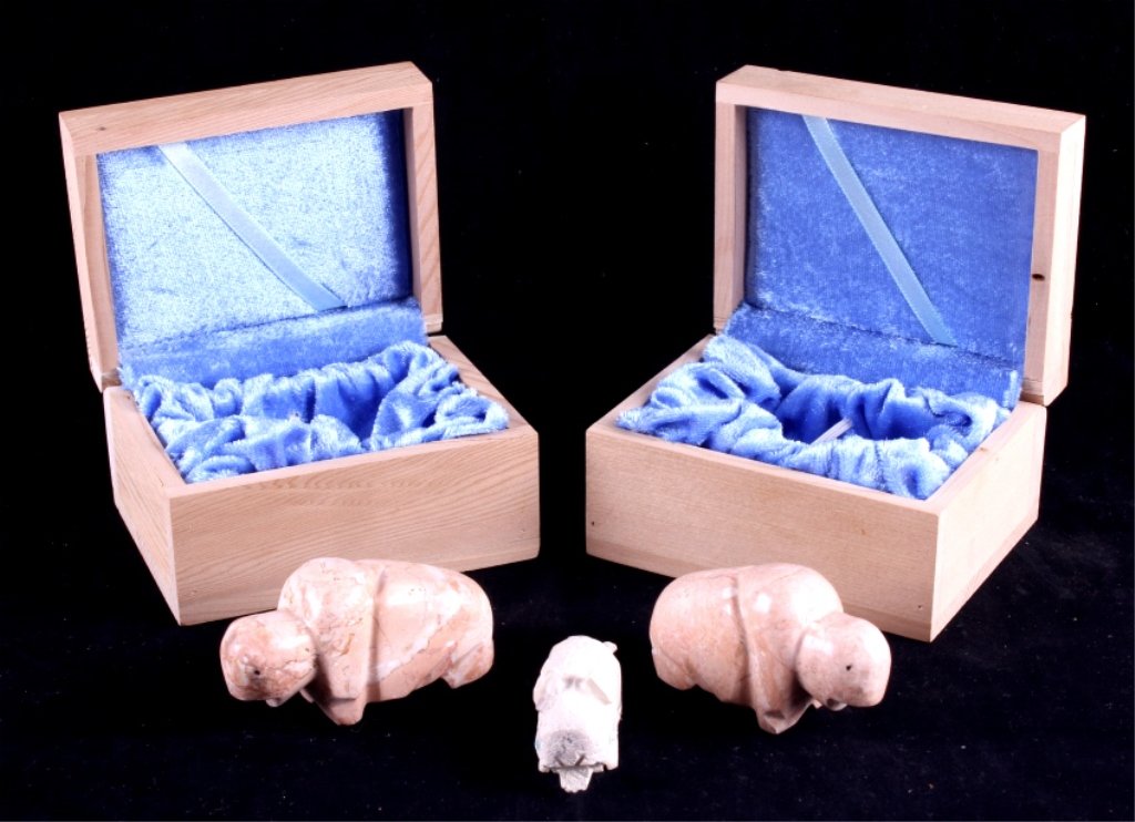 Hand Carved Buffalo Effigies This lot includes thr: This lot includes three hand carved buffalo effigies. Two are carved from marble and one is made from soapstone. Two wooden boxes are included with the effigies. The effigies are in good condition. Th