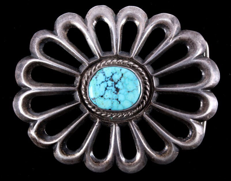Antique Navajo Sand Cast Silver & Turquoise Buckle: The piece is from the Navajo Native American Indians and shows a set turquoise stone with wonderful coloring. The buckle is an early pawn items and shows a wonderful worked and sand cast sterling silv