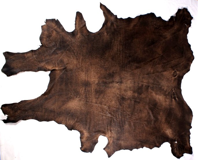 Montana Large Tanned Steer Hide This is a Montana: This is a Montana large steer or cowhide rug. The piece has been tanned and is in good condition. This has a great coloring and shows the original unique spur brand. Measures 94"x106"