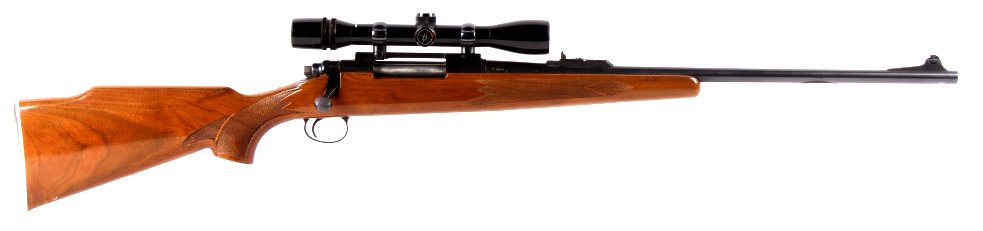 Remington Model 700 30-06 Rifle with Scope This is: This is a Remington Arms Co. Model 700 in a .30-06 SPRG. caliber. The firearms is a bolt action showing a solid wood stock in good condition (normal wear marks) and a blue metal finish. The rifle also