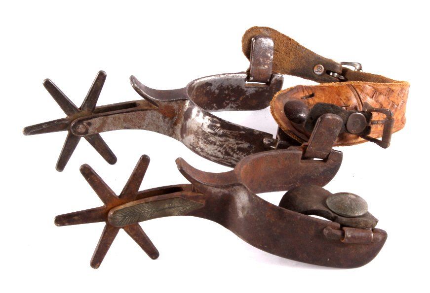 Antique Crockett Forged Spurs with Large Rowels Th: These are original Oscar Crockett forged spur set. These are an early set of Crockett spurs with both being marked. One spur in the set shows original condition with a half mounted silver design and t