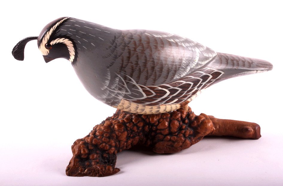Hand Painted Wooden Quail This lot features a hand: This lot features a hand painted wooden quail. This quail is set on a piece of burl wood. It has been signed by the artist "M Michael". The quail is in very good condition. It measures 3.75" x 10" x 6