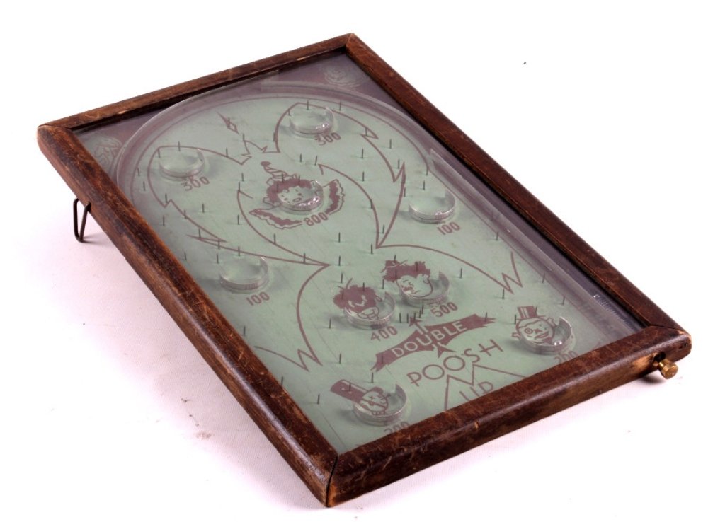 Antique Poosh-M-Up Game This is an antique Poosh-M: This is an antique Poosh-M-Up game. This is an early pinball game. A player shoots the balls into the playing field, trying to get the ball to stop in the unique scoring positions. The game has great 