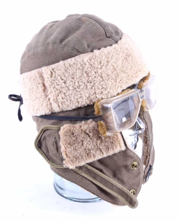 WWII Nazi German Winter Hat & Goggles This is an o: This is an original set of Nazi German World War II winter hat and goggles. The hat shows a sheep skin like lining and outside band, with a front eye lining, and no markings. The goggles are a plastic