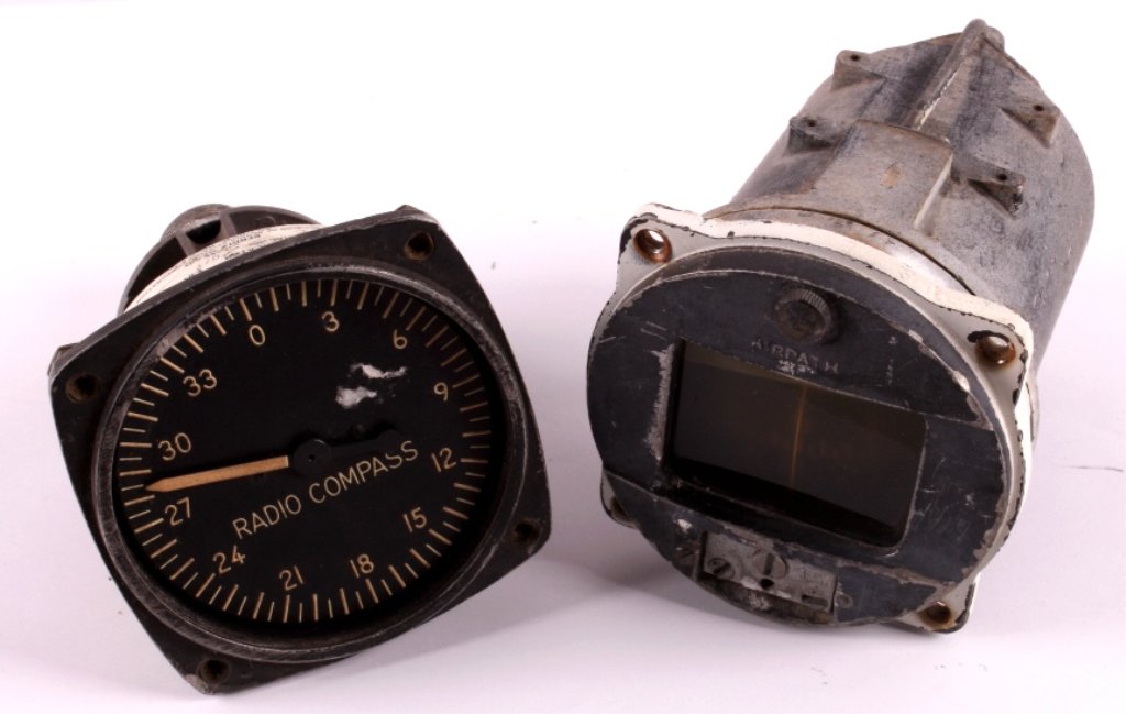 WWII Era Aviation Instruments This is a pair of WW: This is a pair of WWII era aviation instruments. One is a radio compass made for the U.S. Army Signal Corps by the Bendix Aviation Corporation. The other instruments is a compass that is marked "Airpa