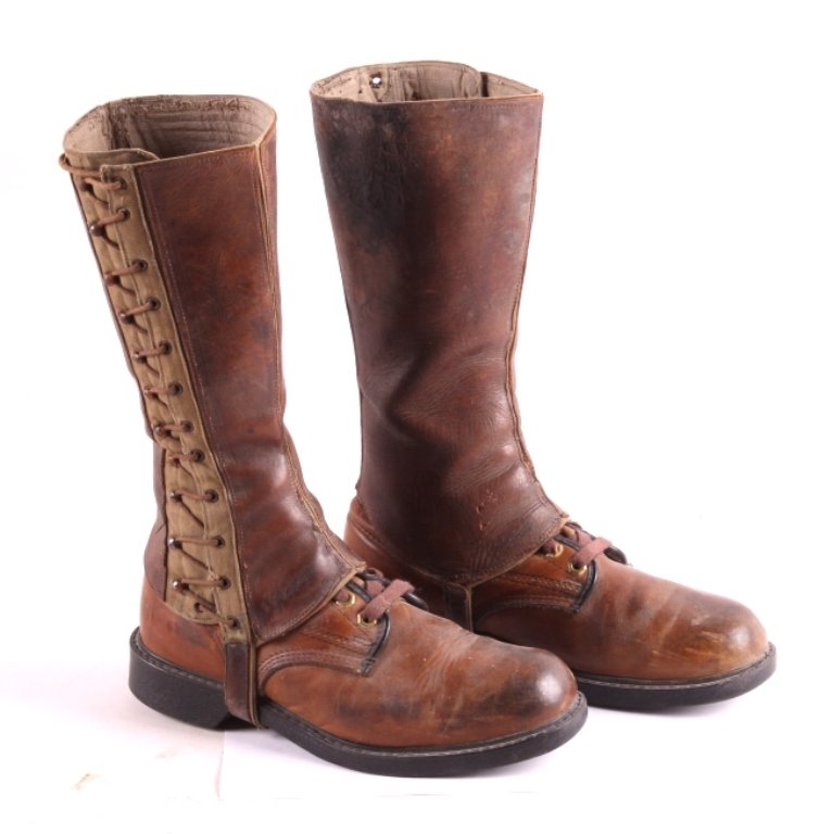 U.S. Army Cavalry Boots and Leggings This is a pai: This is a pair of U.S. Army cavalry boots and leggings. The boots are marked "Wolverine" and made from leather. The leggings are made from leather and canvas. The boots and leggings are in good condit