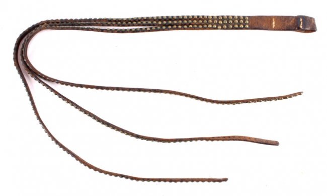 Antique Montana Crow Studded Quirt This is a Monta: This is a Montana Crow Native American Indian hand crafted leather and brass studded quirt. This piece shows wonderful craftsmanship and condition. The piece is very early and believed to be circa 188