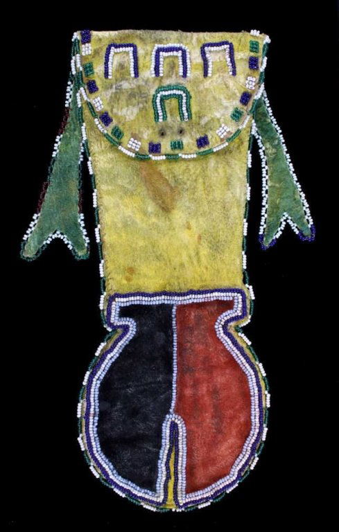 Apache Ocher Dye Beaded Pipe Bag circa 1930-1940 T: The piece is created by an Apache Native American Indian. The bag shows yellow ocher, red ocher, green ocher, and black ocher dye. The bag also has original 1800's trade glass seed beads. This is an o