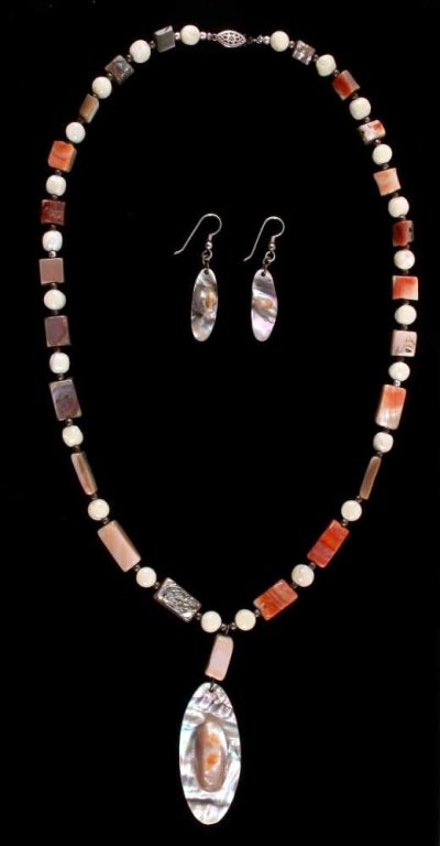 Abalone Pear Necklace & Earring Set This is a poli: This is a polished abalone mother of pearl stone necklace and earring set with polished pearl beads. The necklace has silver beads an a large polished abalone mother of pearl pendant with a unique rai