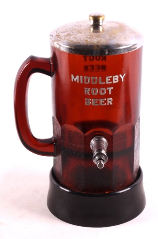Rare Middleby Root Beer Syrup Dispenser This is a: This is a rare Middleby Root Beer syrup dispenser. The dispenser is in the shape of a mug, making it quite desirable to collectors. It is complete as it comes with the spout, lid and base. The base an