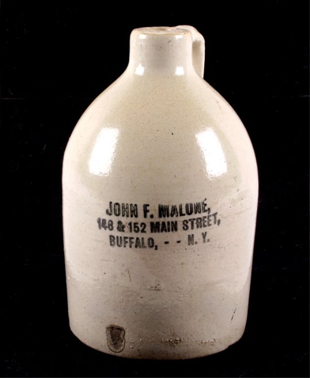 John Malone Buffalo NY Salt Glaze Stoneware Jug Th: This is an original salt glazed stoneware pottery advertising whiskey jug. The piece is marked, "John F. Malone, 148 & 152 Main Street, Buffalo, - - N.Y." The piece has a wonderful beehive salt glazed