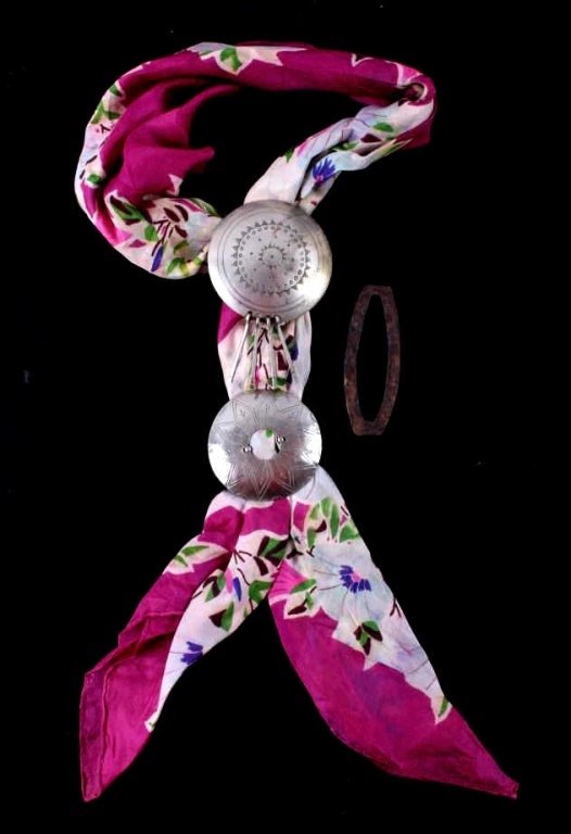 Kiowa Silver Scarf Slides & Peyote Pin 1900 The lo: The lot features original pieces from the Kiowa Native American Indian people. The first is a set of hand tooled silver scarf slides on an early scarf. The other is a Kiowa Peyote blanket slide hand f