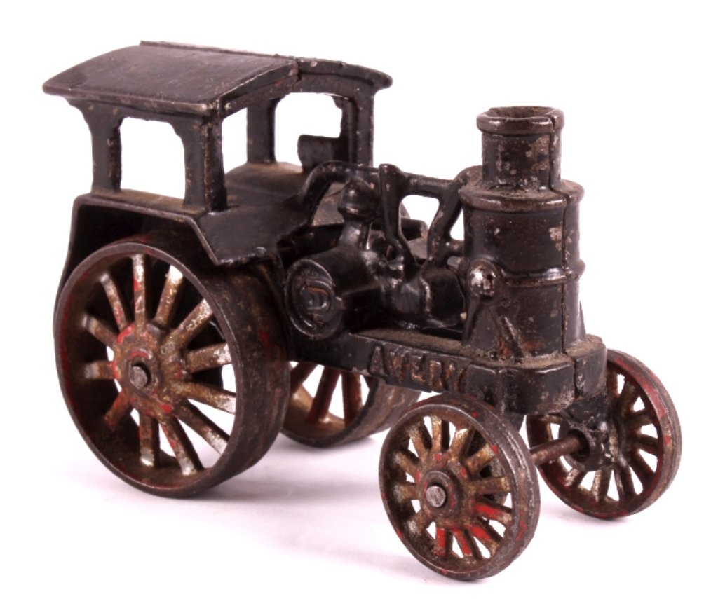1920's Avery Cast Iron Steam Powered Tractor This: This is an original 1920's Avery cast iron steam powered tractor toy. The toy is marked "Avery". It shows some paint loss and was perhaps repainted sometime during its life. The Avery cast iron steam 