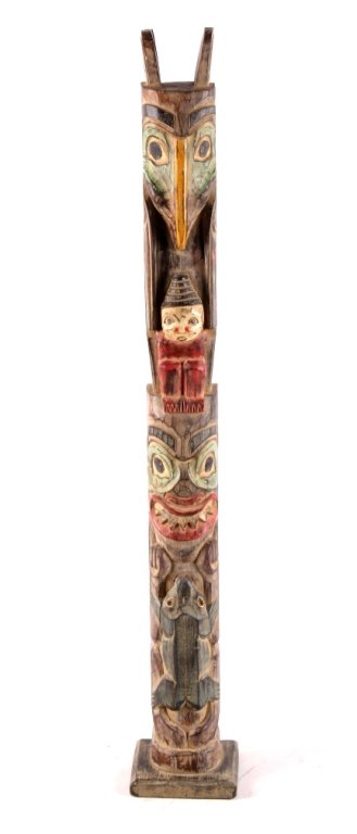 Northwest Coast Carved Totem circa 1900-1930's Thi: This is a carved totem from the Northwest Coast Native American Indians. Carved signed Putuiadi. The piece shows polychrome paint and is an early 20th century circa 1900-1930's. Totem shows eagle hawk