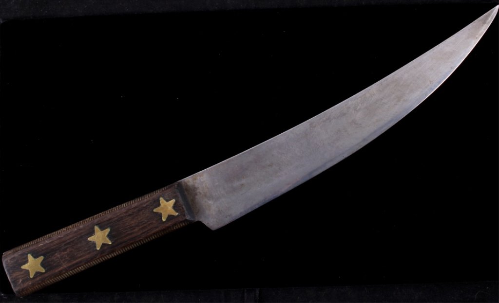 Northern Plains Indian Trade Butcher Knife The ant: The antique knife shows three inlaid brass stars on either side of the file carved wood grips. This is believed to be a butcher trade knife from the Northern Plains Native American Indian people. The