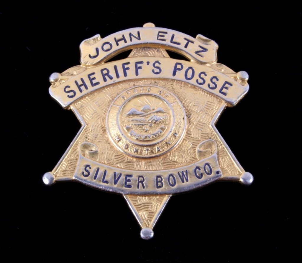 Sheriff's Posse Silver Bow Butte Montana Badge: The lot features an original Butte, Montana Silver Bow County badge. The badge reads, "John Eltz Sheriff's Posse Siler Bow Co. State Of Montana." Rare badge in good condition. Badge was made by Chas.
