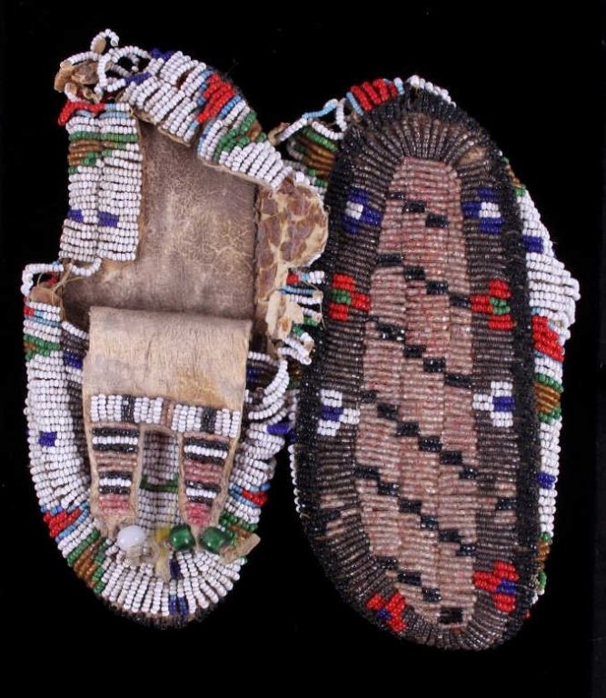 Crow Fully Crazy Beaded Child's Moccasins 1880: This is a set of crazy beaded Crow Native American Indian child's moccasins. The set is from circa 1880 and show the fully beaded tops and soles, a rare set of ceremonial moccasins. 1800's glass trade