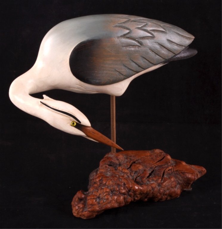 Big Sky Carvers Wooden Carved Great Blue Heron: This is a wooden carved Great Blue Heron made by Big Sky Carvers. The heron is all hand painted and shows great detail. The bird is set on a burl wood base. The bottom has been signed by the artist. T