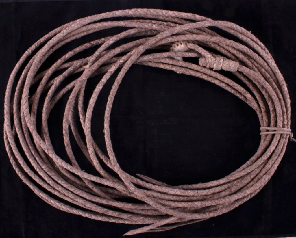 Deer Lodge Prison Made Rawhide Riata: This is a Deer Lodge prison made rawhide riata. The riata shows excellent craftsmanship with a tight, consistent weaving. The riata is in good condition. It measures 44' long.