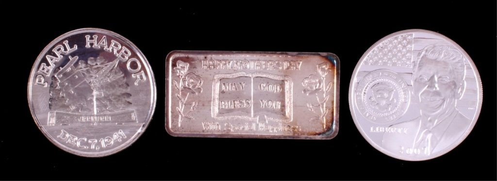 Commemorative .999 Silver Collection: This is a collection of three commemorative silver rounds and bar. Included is a 50th Anniversary of Pearl Harbor one ounce silver round, a Ronald Reagan one ounce silver round, and a Mother's Day one