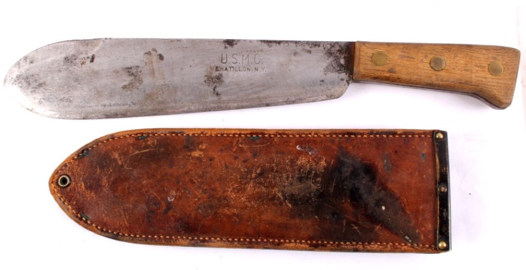 WWII USMC Raider Machete & Sheath: This is a rare World War II United States Marine Corp (U.S.M.C.) Raider's Machete. This has the original leather and brass sheath. The rare knife is marked, "U.S.M.C. Chatillion, N.Y." Overall in shea