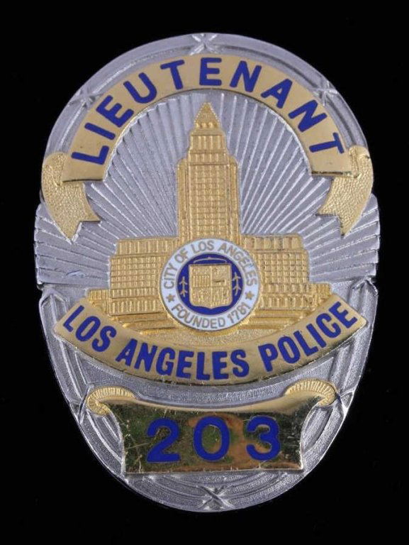 Los Angeles Lieutenant Police Badge Dragnet: This is a Lieutenant Los Angeles Police DIV. metal badge. The badge shows good condition silver & gold toned and enameled lettering with an enameled Police seal. This is a vintage badge with a smooth