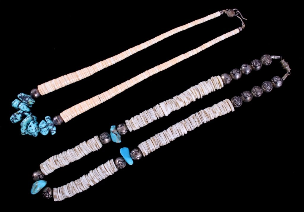 Navajo Sterling Turquoise Nugget Heishi Necklaces: The lot features two original Heishi, Turquoise Nugget, and Sterling Silver beaded trade necklaces from the Navajo Native American Indians. The first shows16 round sterling silver rose beads with larg