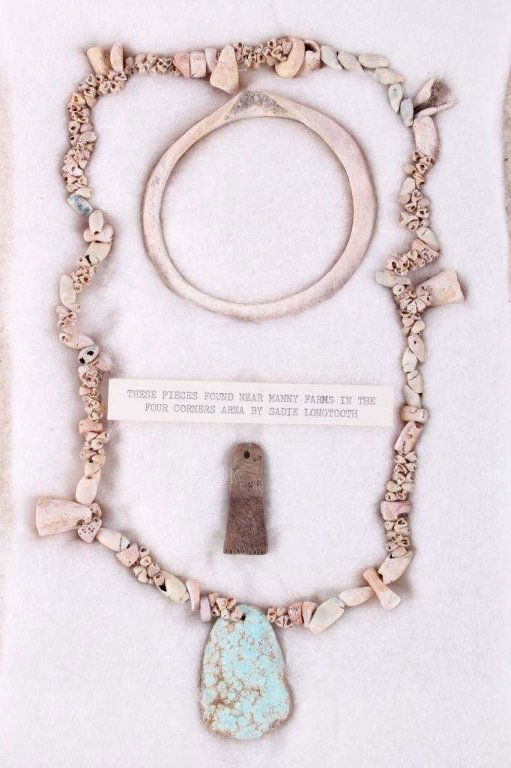 Plains Indian Recovered Artifacts: The lot includes a hand ground trade bead and shell necklace with a large flat turquoise stone, stone scraper necklace pendant, and hand ground stone bangle bracelet. These pieces were all recovered n