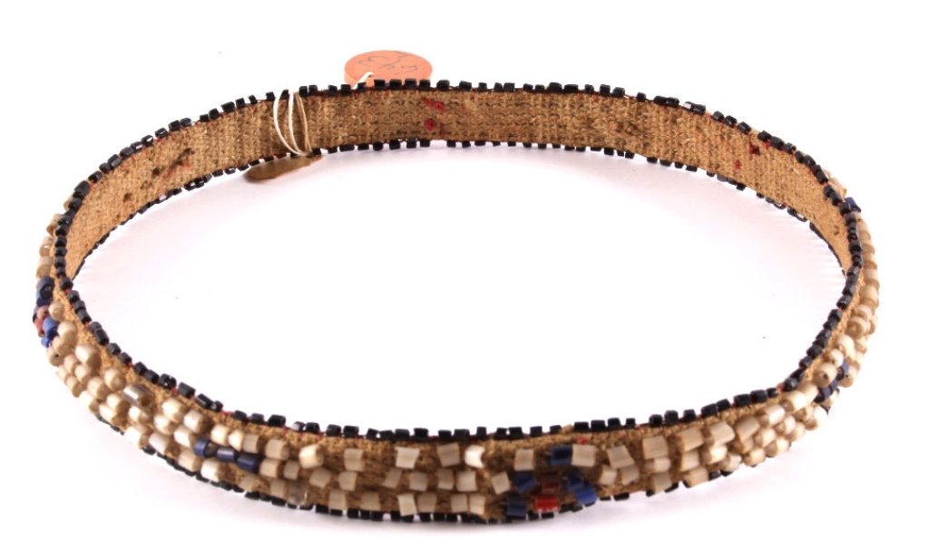 Northern Plains Beaded Hat Band Otto Ernst 1900: This is a Northern Plains Beaded hat band from the Otto Ernst Collection. The piece features uncommonly seen hand cut early 19th century glass tube trade beads sewn to a trade canvas base. The piece i
