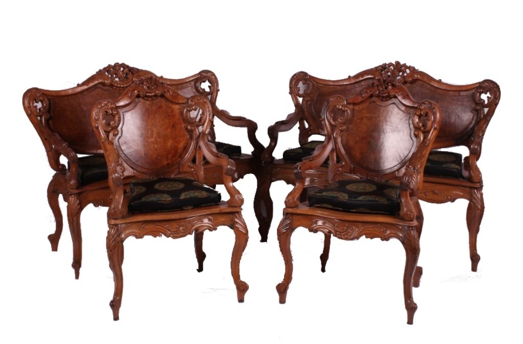 Thailand Embassy Antique Rosewood Furniture: This is a set of antique rosewood furniture from the U.S. Embassy in Thailand. This set includes two settees and two chairs. Each piece shows beautifully carved backs, arms, and legs. The back rests a