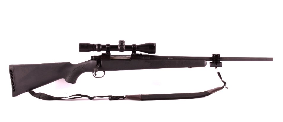 Mossberg ATR .30-06 Rifle with Scope: This is a Mossberg ATR .30-06 rifle and scope. This is a bolt action rifle that features a synthetic stock with sporterized grips and a recoil pad. The rifle has a Lightning Bolt Action Trigger System