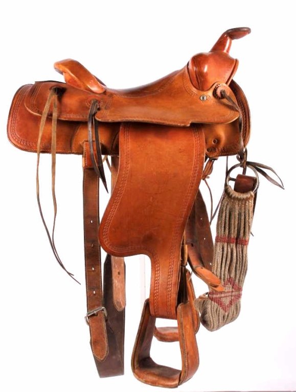 Bona Allen Tooled Saddle Fort Worth, Texas: This is a hand crafted leather Western Cowboy tooled saddle from Bona Allen of Fort Worth, Texas. The piece shows good condition with little wear. This has a tooled braided design across the entire pi