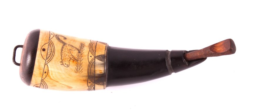 Scrimshaw Powder Horn: This is a scrimshaw powder horn. This is a contemporary piece made using centuries old techniques. Scrimshaw is a form of art originally done by sailors. They would engrave scenes from the sea into wh